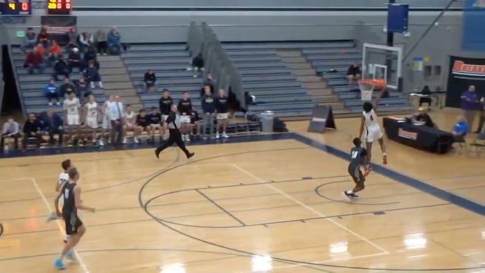 Screenshot from viral video where announcer brings up dead dog during dunk